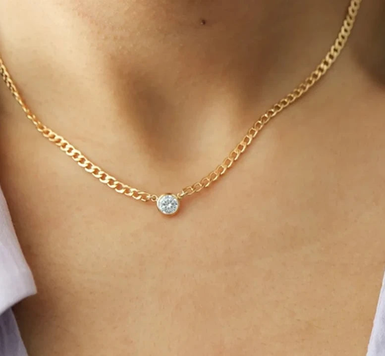 woman wearing gold curb chain necklace